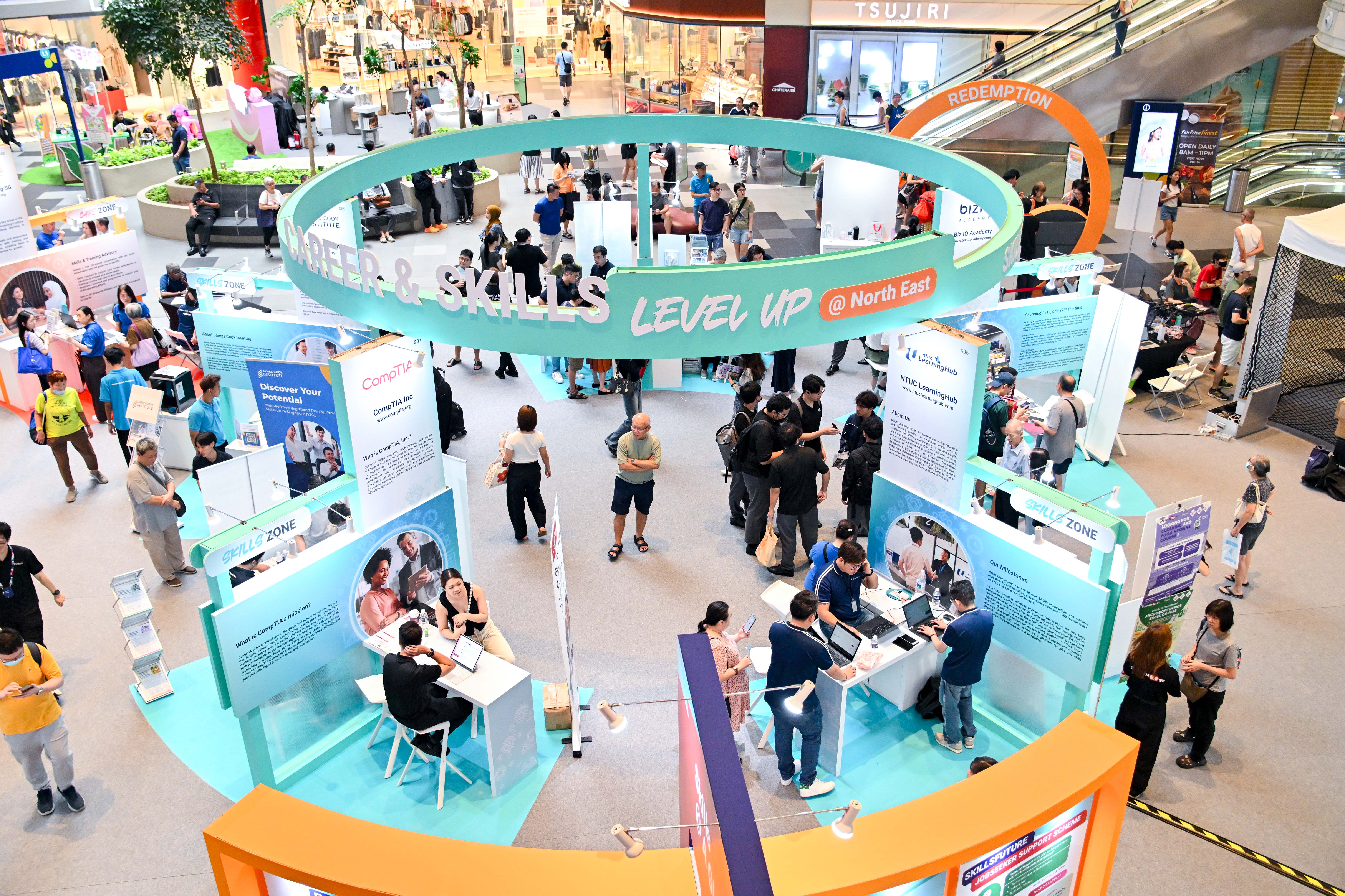 Event setup in a mall showcasing career and skills development opportunities through interactive booths, training providers, and informational displays.